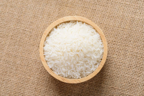 istock Organic Thai Jasmine rice grain in wooden bowl 1218676536