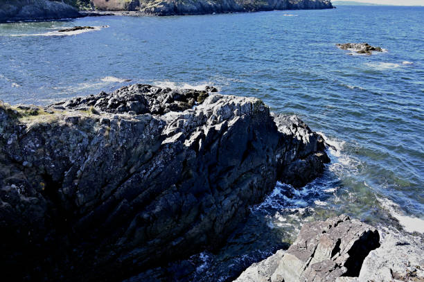 istock Coastal Rock Cliff with view of Sea 1218679321