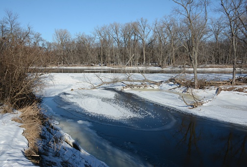 Bright winter vista on the Upper Mississippi River flowage in central Minnesota.