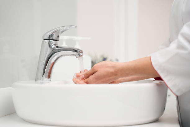 istock Close up of practitioner that washing hands 1218681098