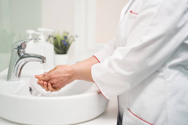 istock Close up of competent practitioner that washing hands 1218681101