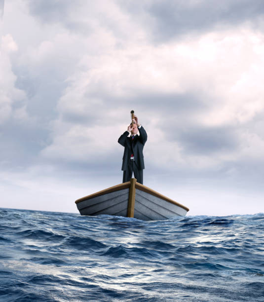 istock Man Searching The Horizon In A Boat 1218685164