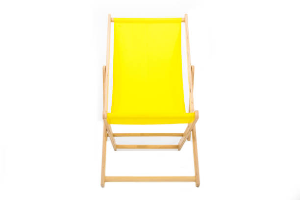istock Yellow wooden folding chair isolated on white 1218687693