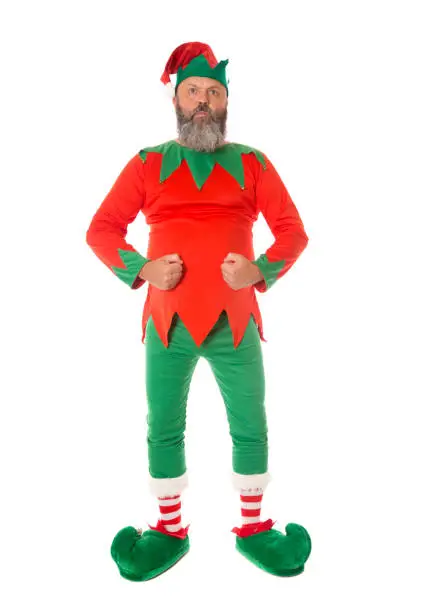A Christmas Elf in an aggressive strong stance, possibly a security guard - fun concepts.