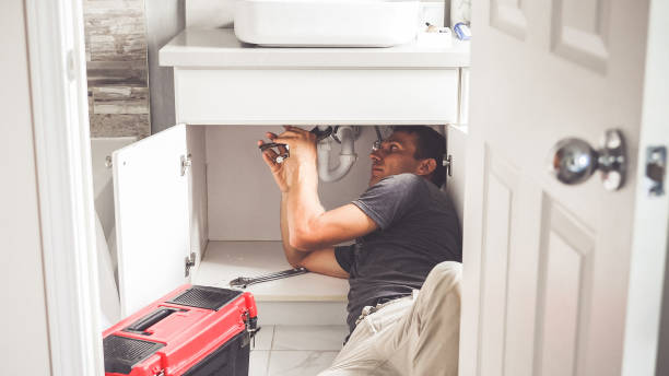 plumber man with tools in the bathroom. plumbing and renovation - manual worker one person young adult men imagens e fotografias de stock