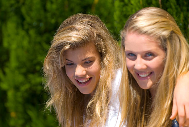 istock Teenage girlfriends smiling 121869024