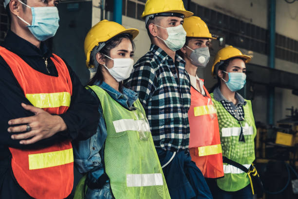 istock Workers with face mask protect from outbreak of Corona Virus Disease 2019. 1218694279