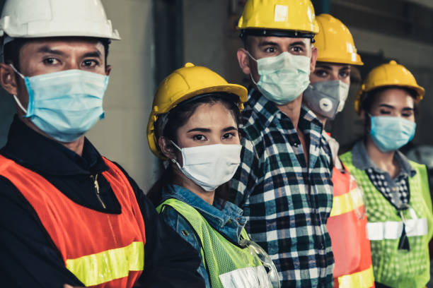 istock Workers with face mask protect from outbreak of Corona Virus Disease 2019. 1218694350