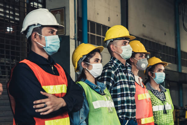 istock Workers with face mask protect from outbreak of Corona Virus Disease 2019. 1218694351