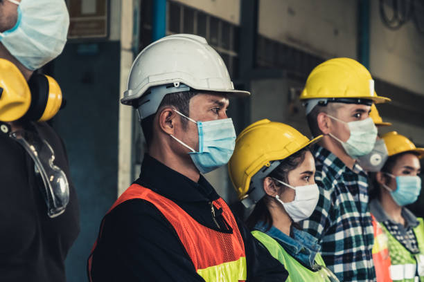 istock Workers with face mask protect from outbreak of Corona Virus Disease 2019. 1218694379