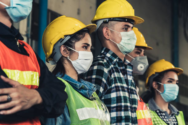 istock Workers with face mask protect from outbreak of Corona Virus Disease 2019. 1218694476