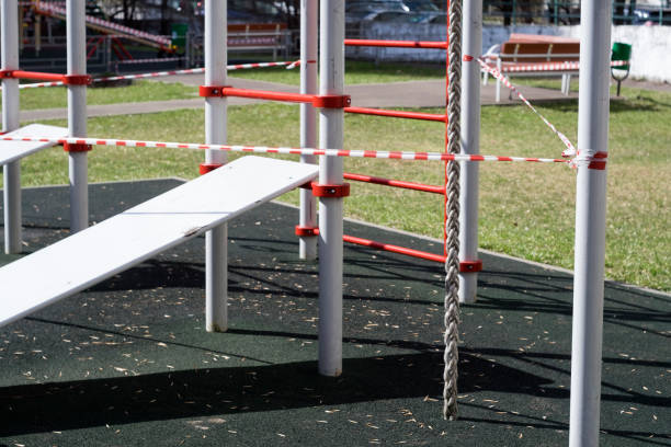 istock playground blocked with warning tape 1218696353