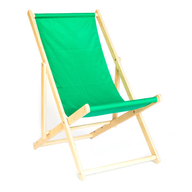 istock Green wooden folding chair isolated on white 1218697170