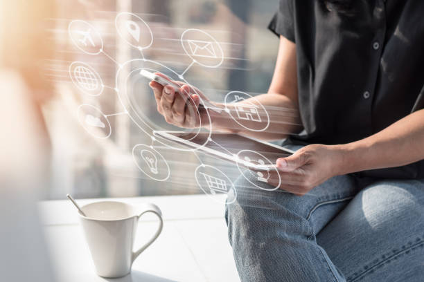 istock Internet of things - IOT via communication network service on mobile apps on smartphone and digital tablet technology for people work online at home or remote workplace 1218698333