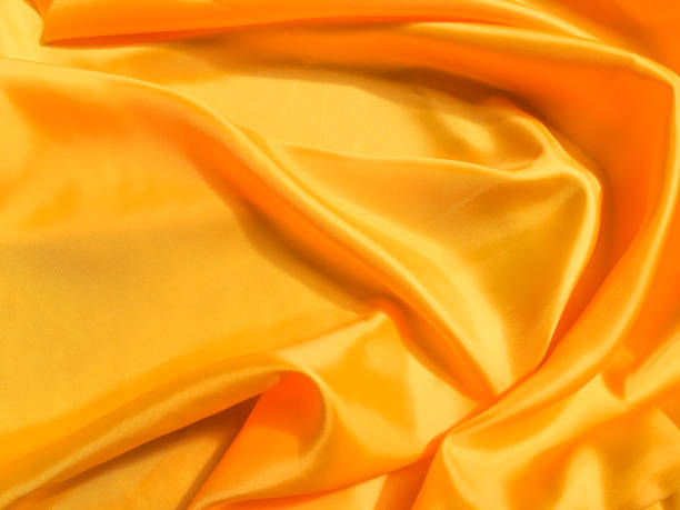 istock Minimal yellow fabric texture background. smooth elegant wavy light with cpoy space 1218699550