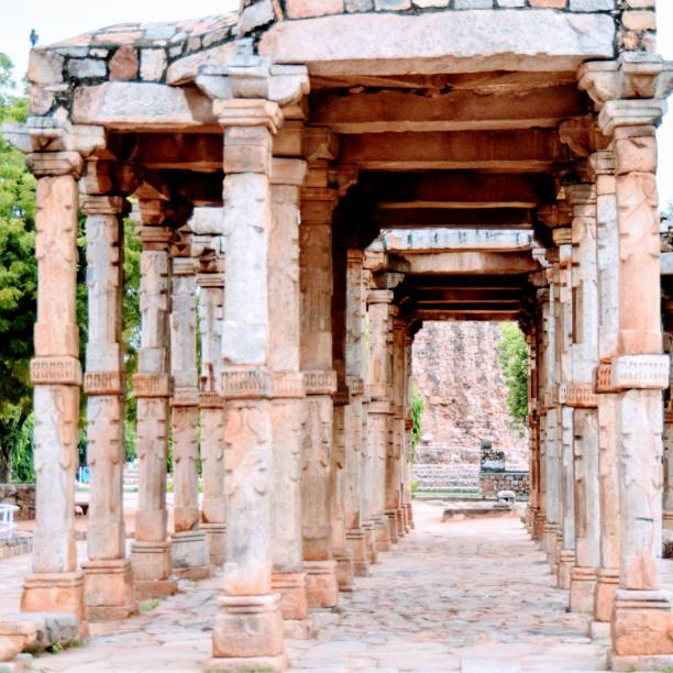 istock Inside the Qutub Minar Complex with antic ruins and inner square. UNESCO World Heritage in Mehrauli, Old Architecture inside Qutub Minar during the day time in Delhi India, Qutub Minar inside old architecture 1218700466
