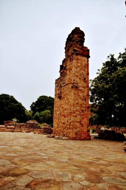 istock Inside the Qutub Minar Complex with antic ruins and inner square. UNESCO World Heritage in Mehrauli, Old Architecture inside Qutub Minar during the day time in Delhi India, Qutub Minar inside old architecture 1218700864