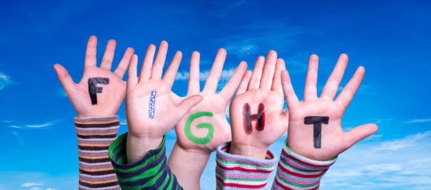 istock Children Hands Building Word Fight, Blue Sky 1218705035