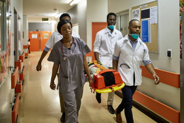 istock African Emergency Team Carrying Patient on Stretcher 1218705958