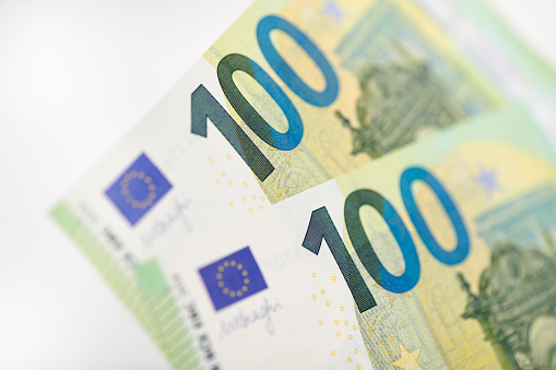 High resolution photograph of  two 100 Euro bills, selective focus.