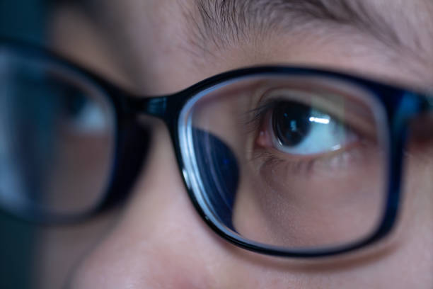 istock Close-up of eyes while using mobile phone 1218707387