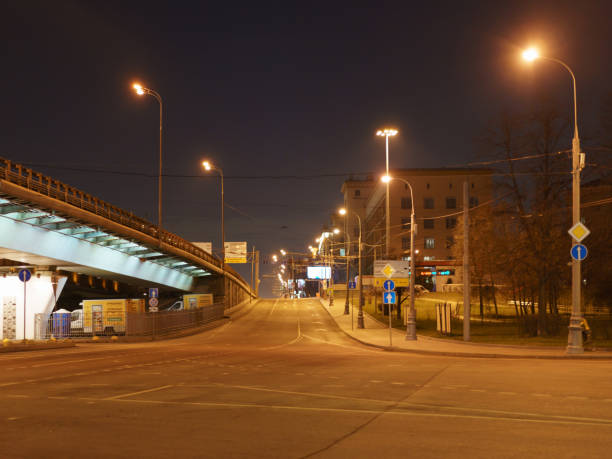 Moscow, Russia - April 8, 2020 Moscow desert city street. No people. No traffic. Night in spring time. Coronavirus pandemic  lifestyle.