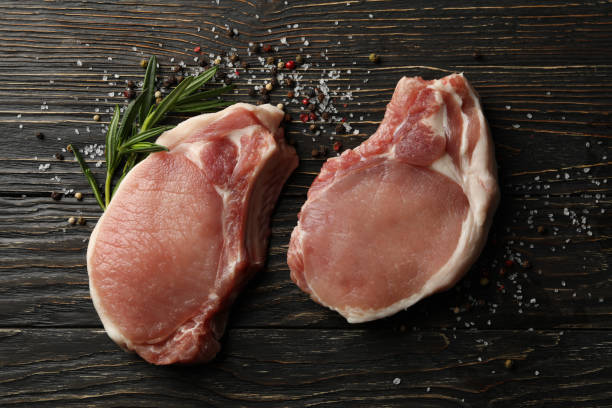 istock Composition with raw meat for steak and spices on wooden background 1218708672