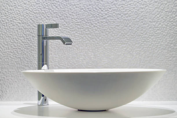 Bathroom interior sink with modern design. Interior of bathroom with washbasin and faucet
