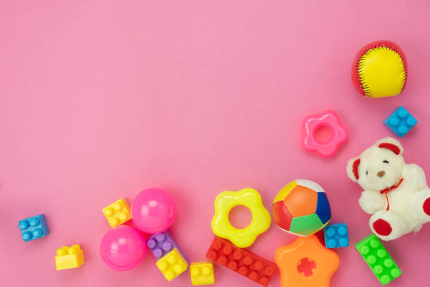 istock Table top view decoration kid toys for develop background concept.Flat lay accessories baby to play with items child on modern pink paper at office desk.Copy space for add text.pastel tone wallpaper. 1218710308