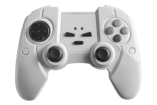 White wireless gamepad for playing video games. Joystick or game controller on a white background. Copy space for text
