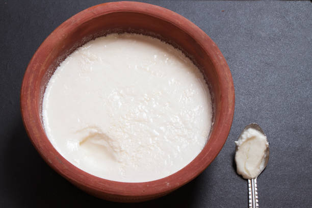 Home made curd in a earthen bowl Home made curd in a earthen bowl curd cheese stock pictures, royalty-free photos & images