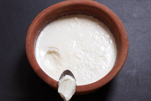 istock Home made curd in a earthen bowl 1218711610