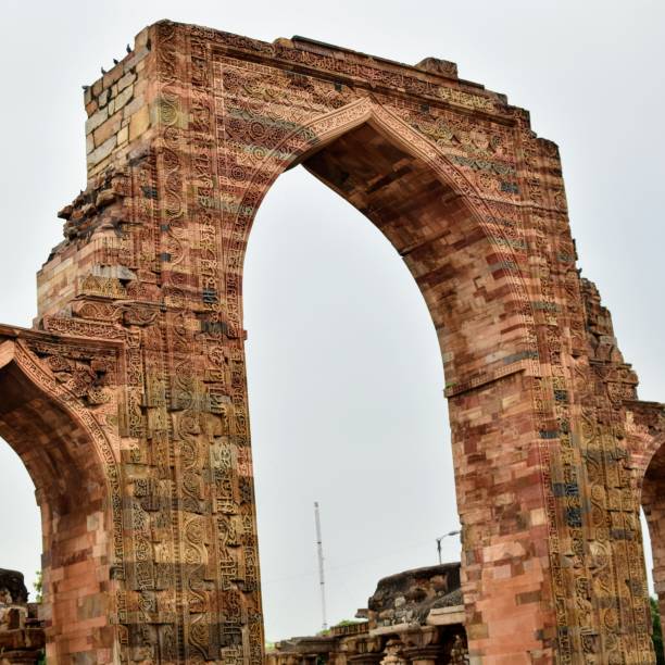 istock Inside the Qutub Minar Complex with antic ruins and inner square. UNESCO World Heritage in Mehrauli, Old Architecture inside Qutub Minar during the day time in Delhi India, Qutub Minar inside old architecture 1218712799