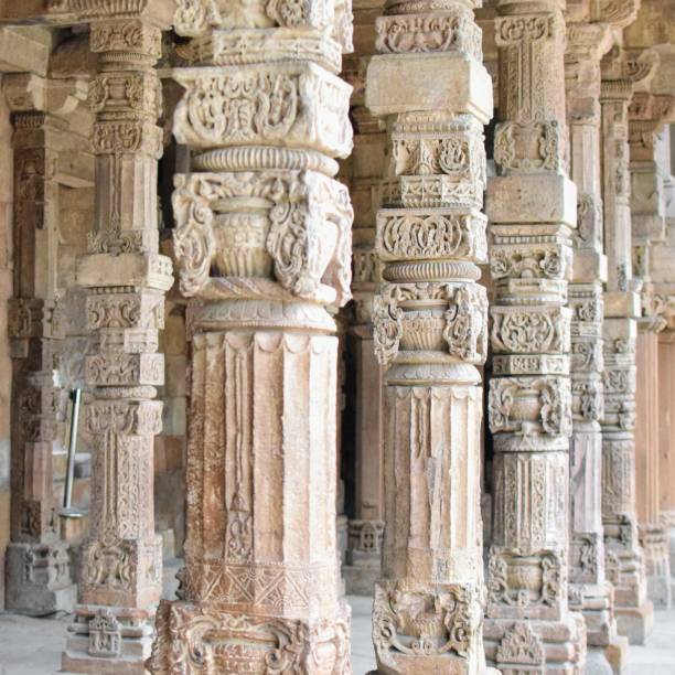 istock Inside the Qutub Minar Complex with antic ruins and inner square. UNESCO World Heritage in Mehrauli, Old Architecture inside Qutub Minar during the day time in Delhi India, Qutub Minar inside old architecture 1218712885