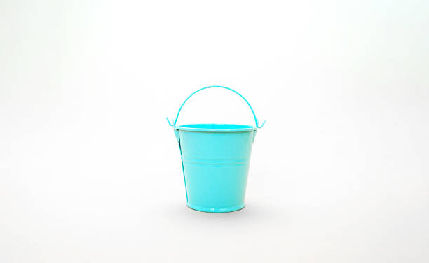 istock Blue metal miniature bucket with raised handles on a white background 1218712895