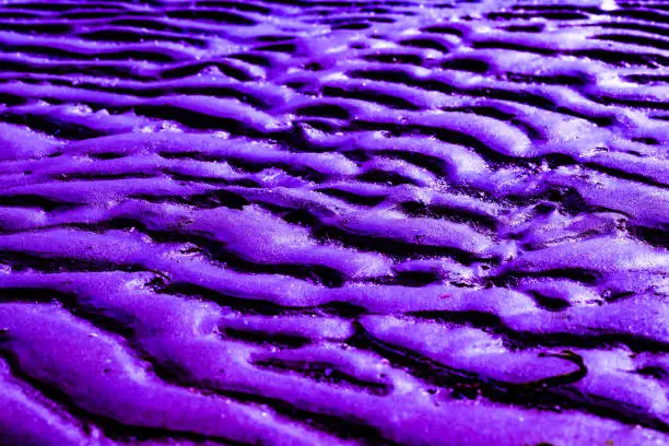 Natural abstract texture background. Dark sand stone background.purple.
