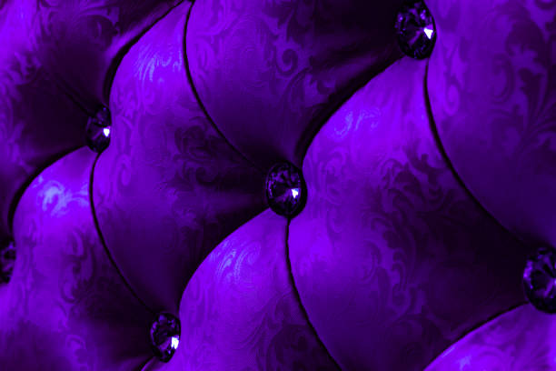 Detail of a studded red leather armchair