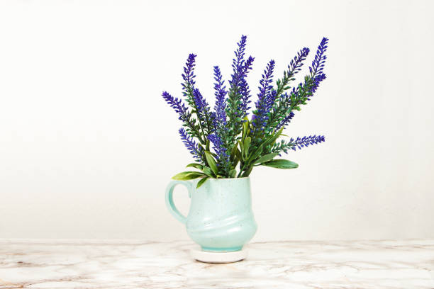 istock Lavender flowers in a mug on a marble table 1218713684