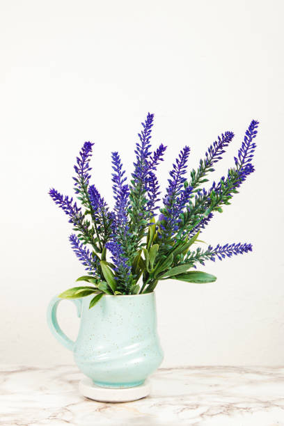 istock Lavender flowers in a mug on a marble table 1218713707
