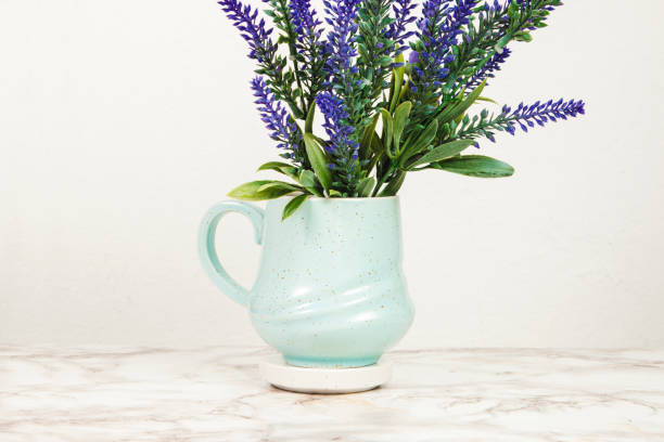 istock Lavender flowers in a mug on a marble table 1218713714