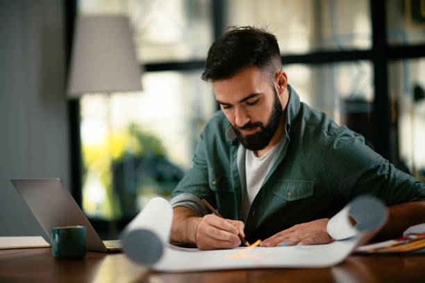 istock Young businessman working on new project in office. 1218716453