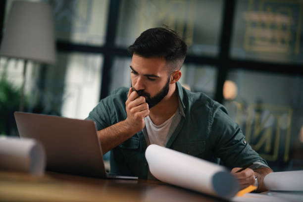 istock Young businessman working on new project in office. 1218716675