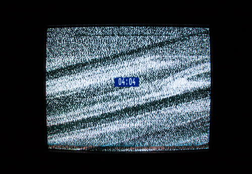 Glitch and digital clock on the screen. Glitch art. Digital errors. Digital artifacts. Pixel noise.