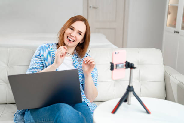 istock blogger conducts live communicate online via phone 1218718846