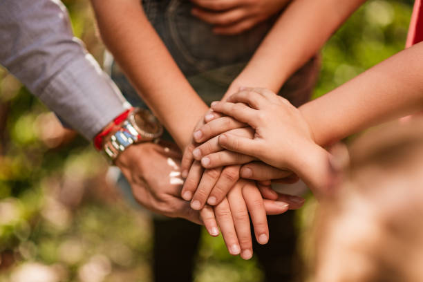 istock United hands of happy children 1218719599