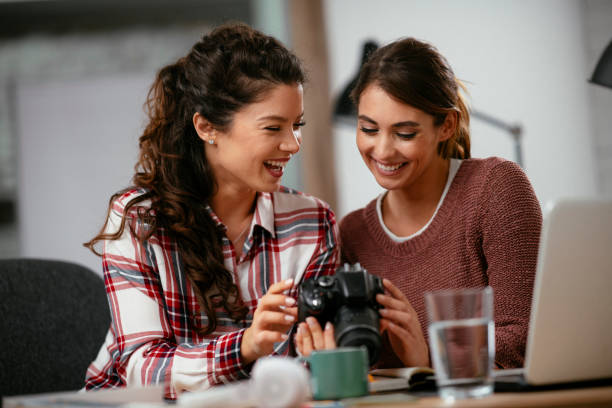 istock Girlfriends have fun while working together in the office. 1218719796