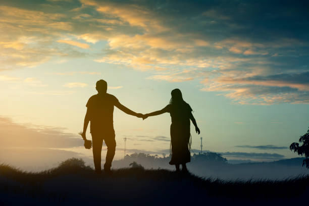istock Young couple enjoying the sunset 1218719850