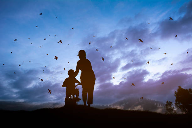 istock mother help his son ride a bicycle 1218719870
