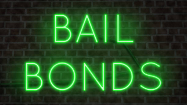 Bail Bonds sign Neon sign for BAIL BONDS on a wall at night bail stock pictures, royalty-free photos & images