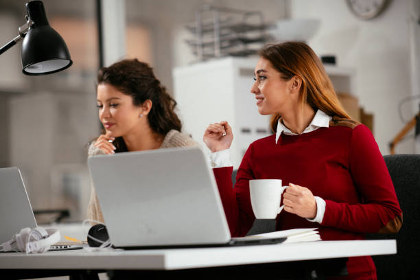 istock Girlfriends working together in the office 1218719974